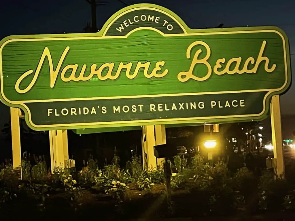 Navarre Beach Welcome sign at night